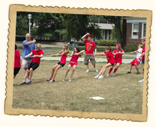Kids having fun playing Tug of War at summer camp